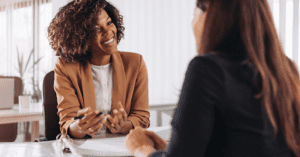 Two people discuss and share ideas to increase SEO.